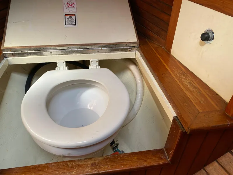 Slide: The Image of Toilet in 1981 Hans Christian 38 Mark II sailboat, wooden interior, open lid. - 23