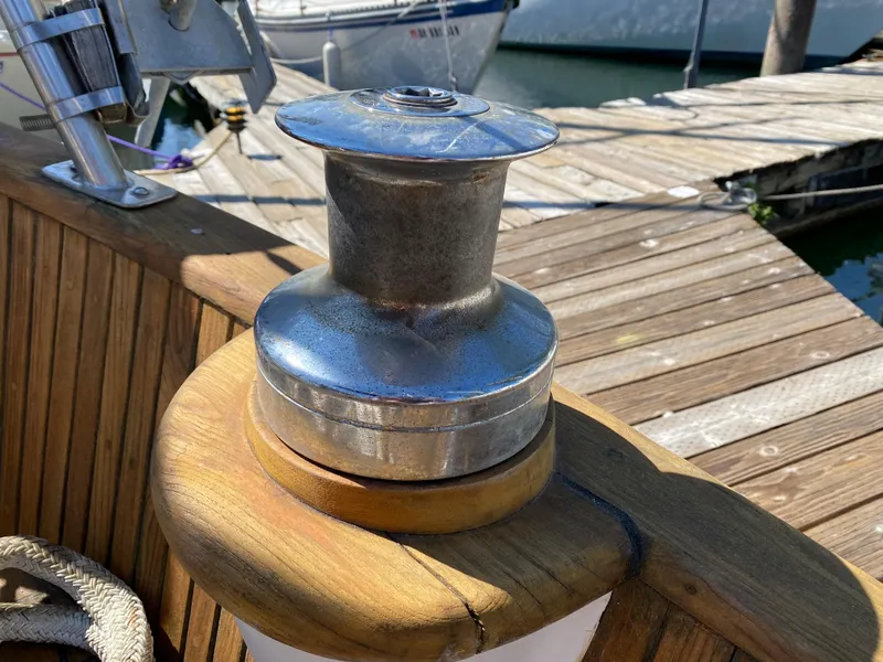 Slide: The Image of Winch on 1981 Hans Christian 38 Mark II sailboat, docked with wooden deck. - 31