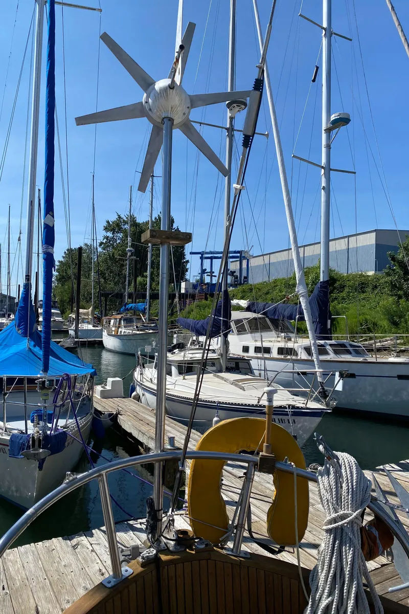 Slide: The Image of 1981 Hans Christian 38 Mark II sailboat docked at marina with clear blue sky. - 35