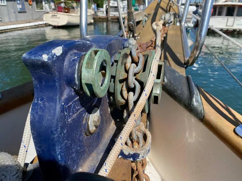 Slide: The Image of Anchor chain and windlass on 1981 Hans Christian 38 Mark II sailboat deck. - 36
