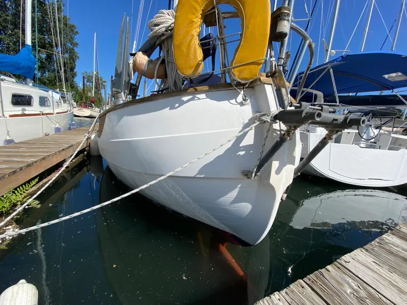Slide: The Image of 1981 Hans Christian 38 Mark II sailboat docked at marina, sunny day, clear blue sky. - 43