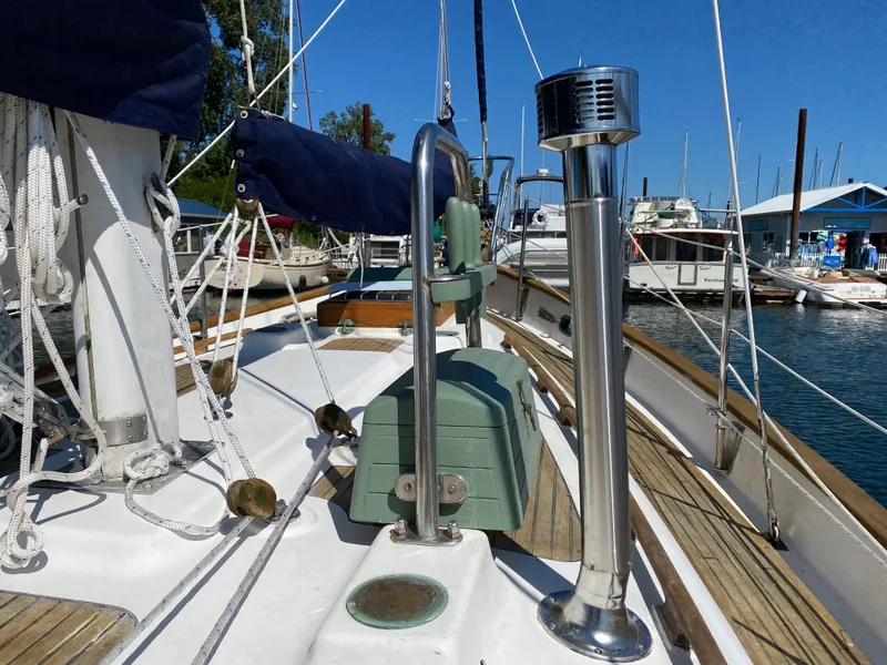 Slide: The Image of 1981 Hans Christian 38 Mark II sailboat deck with rigging and marina view. - 44