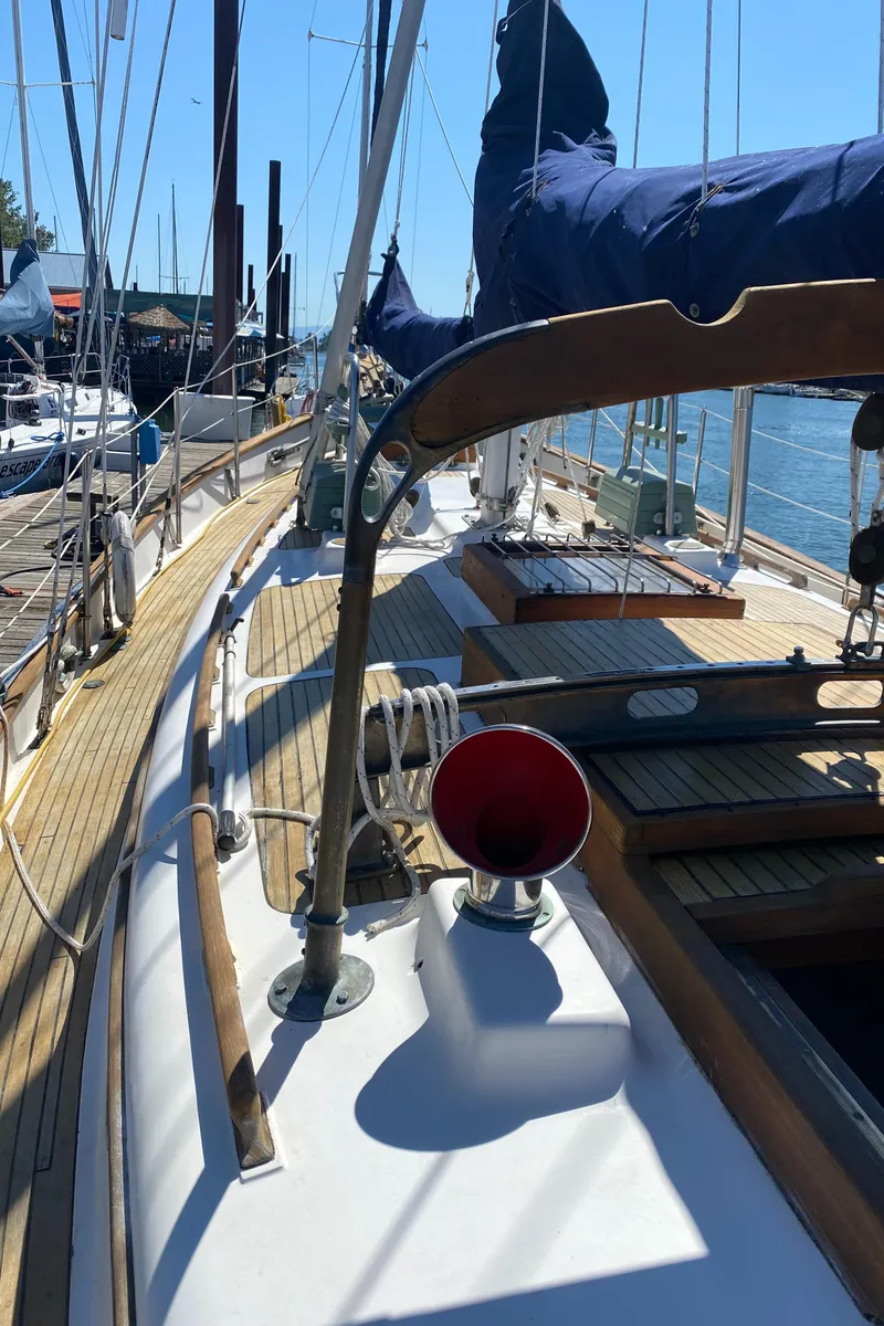 Slide: The Image of Deck of a 1981 Hans Christian 38 Mark II sailboat in harbor. - 46