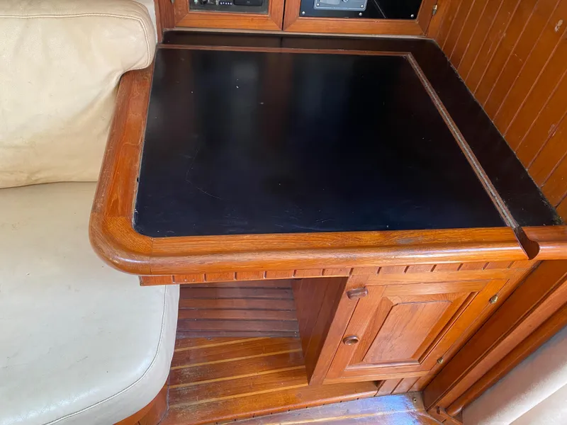 Slide: The Image of Wooden navigation desk on 1981 Hans Christian 38 Mark II sailboat interior. - 7