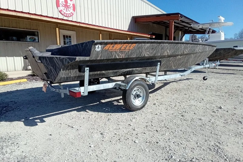 Slide: The Image of 2026 Alweld 1756 Invader boat on trailer outside a building. - 10