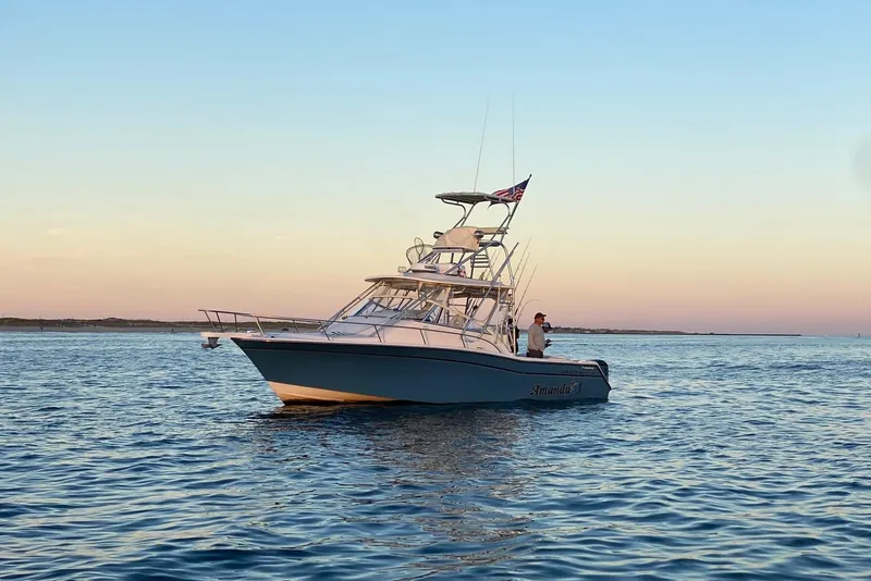 The Image of 2005 Grady-White Express 330 boat on calm water at sunset. - 0