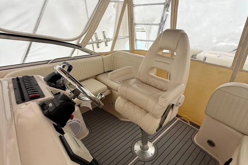 Slide: The Image of 2005 Grady-White Express 330 helm with luxurious seating and modern controls. - 12