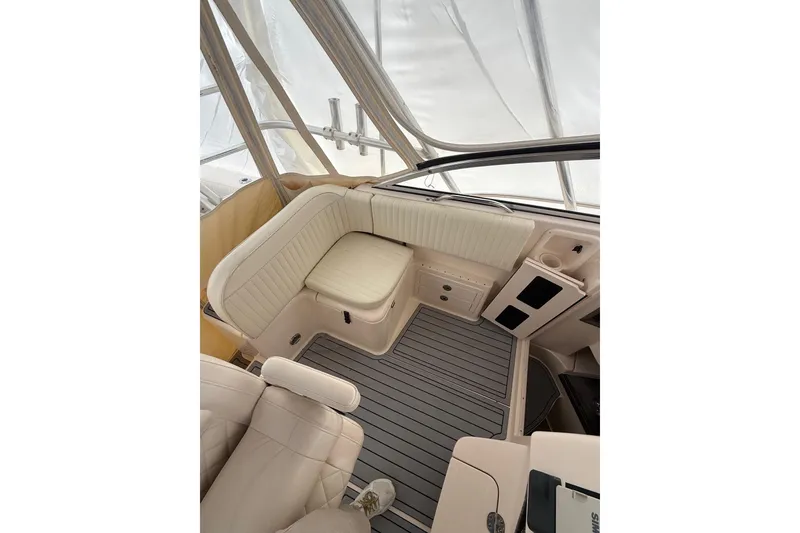 Slide: The Image of 2005 Grady-White Express 330 boat interior with cushioned seating and sleek design. - 13