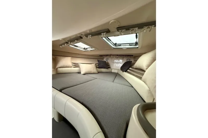 Slide: The Image of 2005 Grady-White Express 330 cabin interior with cozy seating and skylights. - 17