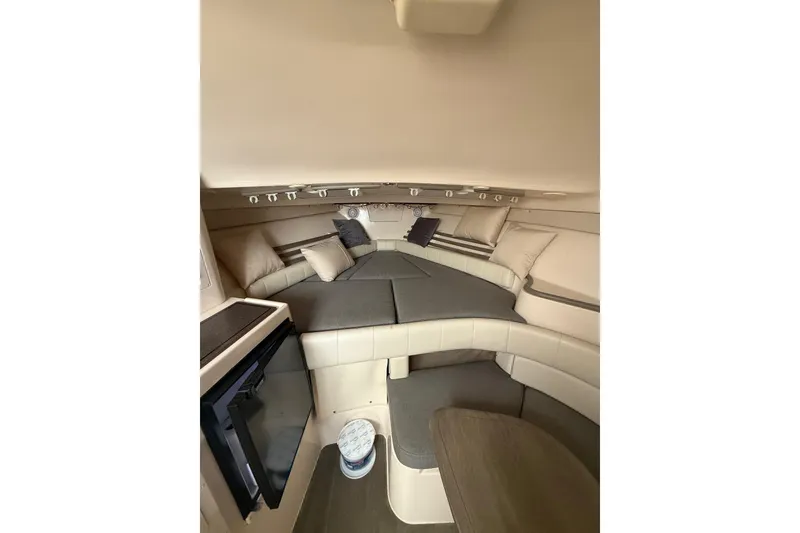 Slide: The Image of 2005 Grady-White Express 330 cabin interior with cozy seating and cushions. - 19