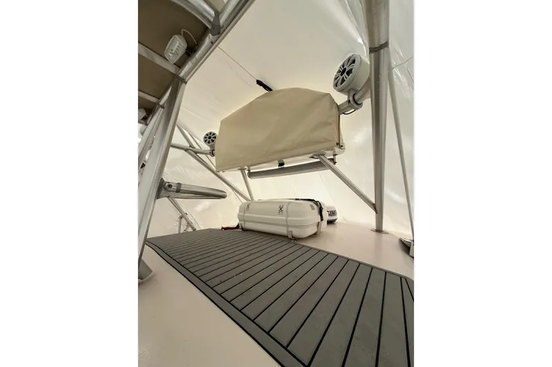 Slide: The Image of Interior view of 2005 Grady-White Express 330 boat, featuring speakers and storage area. - 25