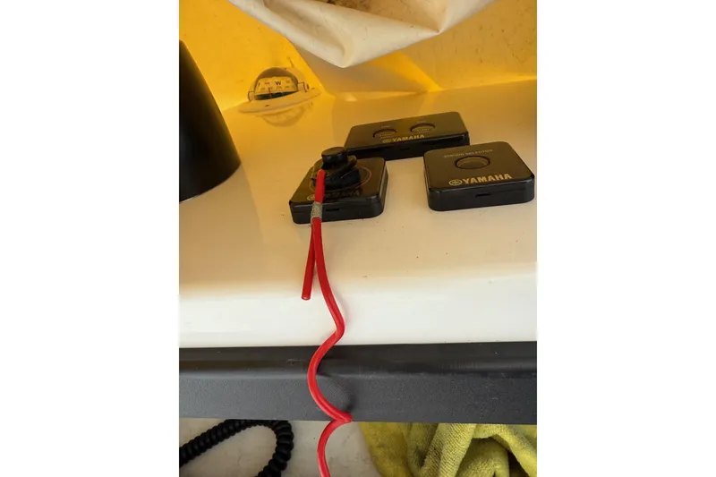 Slide: The Image of Yamaha ignition switches with red safety lanyard on 2005 Grady-White Express 330 boat. - 29