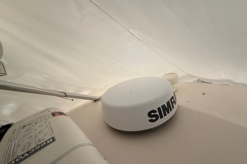 Slide: The Image of 2005 Grady-White Express 330 boat with Simrad radar under cover. - 31