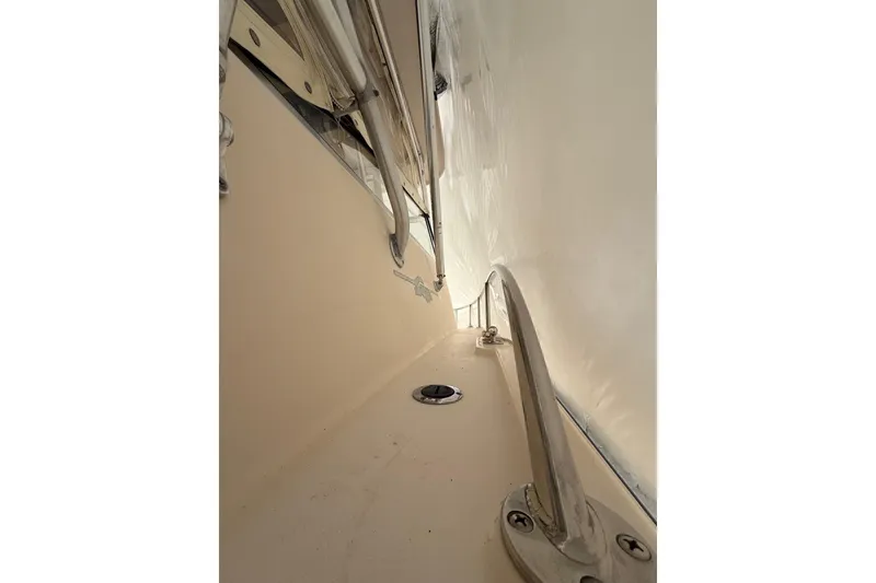 Slide: The Image of 2005 Grady-White Express 330 boat deck with stainless steel railing and fittings. - 34