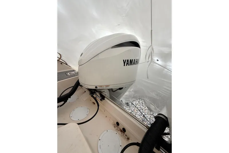 Slide: The Image of 2005 Grady-White Express 330 boat with Yamaha outboard motor in protective cover. - 38