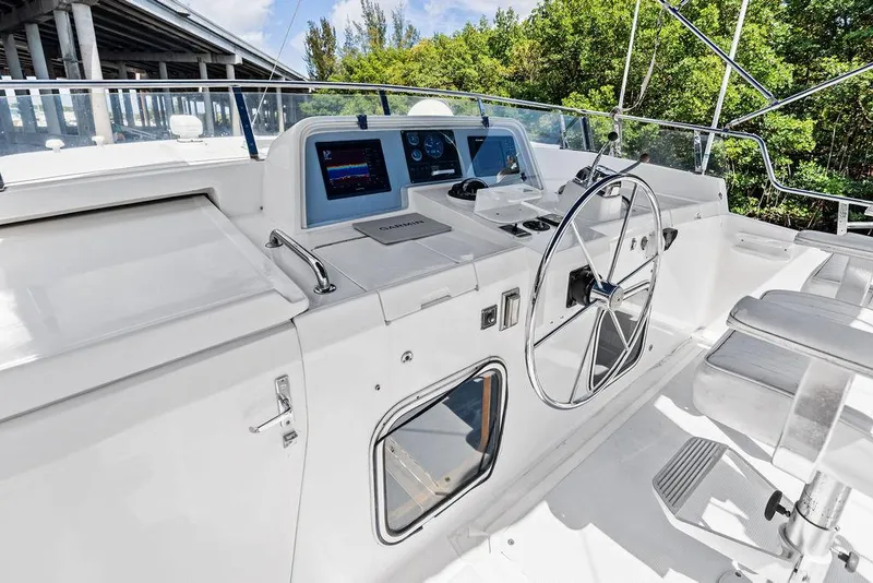 Slide: The Image of Helm of 2000 Selene Solo yacht with steering wheel and navigation displays. - 12