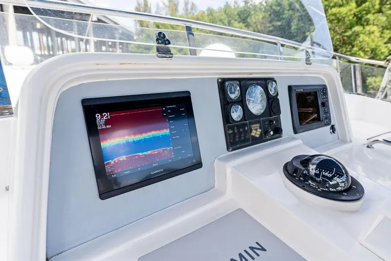 Slide: The Image of Boat dashboard with navigation screens and compass, Selene Solo 2000 model. - 13
