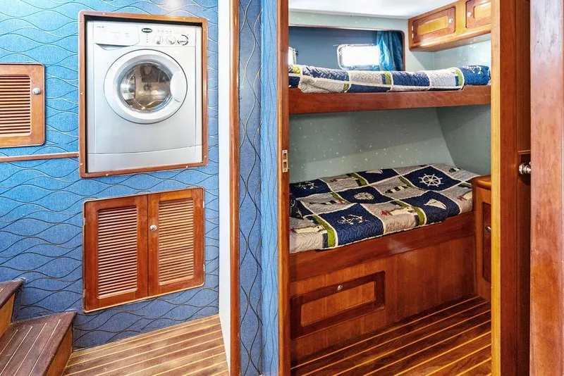 Slide: The Image of Cozy Selene Solo 2000 yacht interior with bunk beds and washing machine. - 26