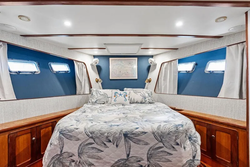 Slide: The Image of Cozy bedroom in 2000 Selene Solo yacht with nautical decor and elegant wood finishes. - 30