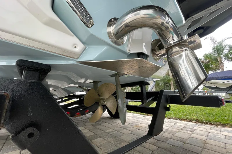 Slide: The Image of 2025 Nautique Super Air Nautique G23 Paragon boat propeller and exhaust detail. - 10