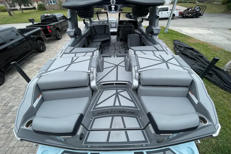 Slide: The Image of 2025 Nautique Super Air Nautique G23 Paragon boat interior with luxurious seating and modern design. - 14