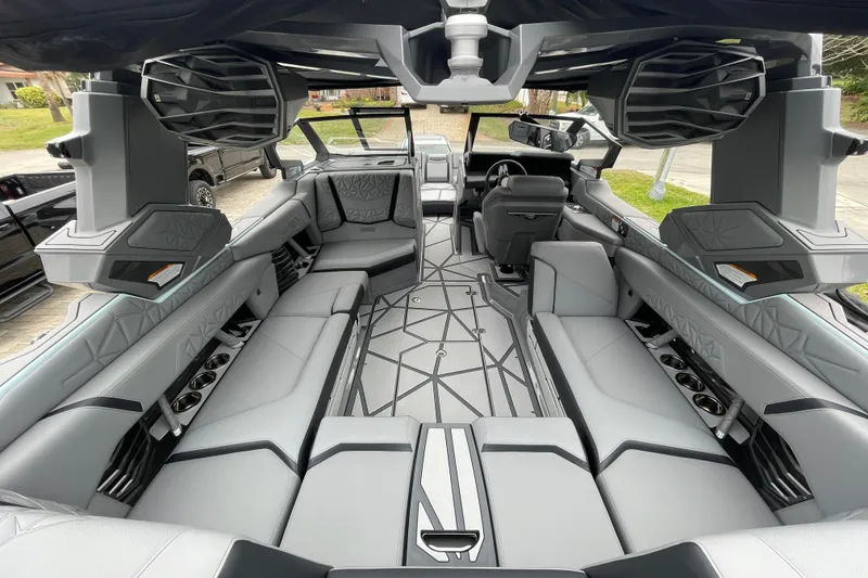 Slide: The Image of Luxurious interior of 2025 Nautique Super Air Nautique G23 Paragon boat, featuring sleek seating and modern design. - 17