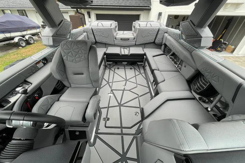 Slide: The Image of 2025 Nautique Super Air Nautique G23 Paragon interior with luxurious gray seating and modern design. - 20