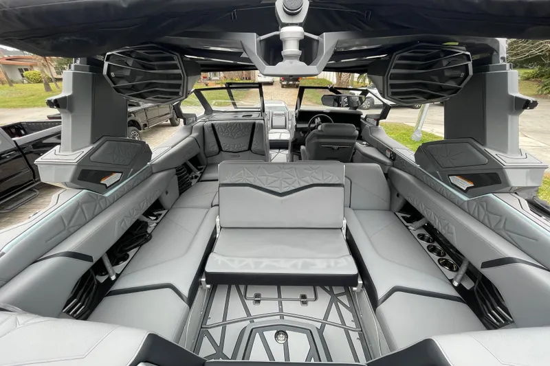 Slide: The Image of Interior of 2025 Nautique Super Air Nautique G23 Paragon, featuring luxurious seating and advanced audio system. - 25