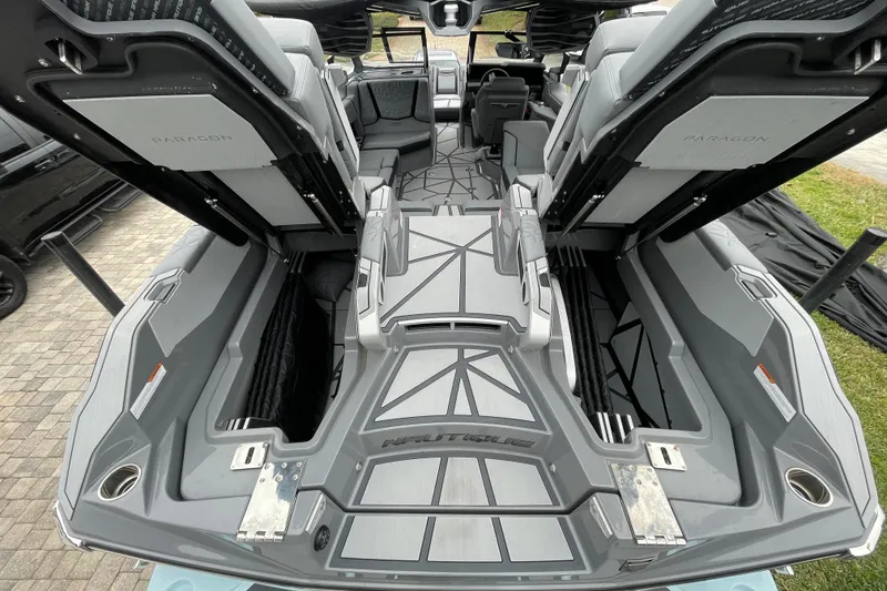 Slide: The Image of 2025 Nautique Super Air Nautique G23 Paragon interior with open storage compartments. - 27