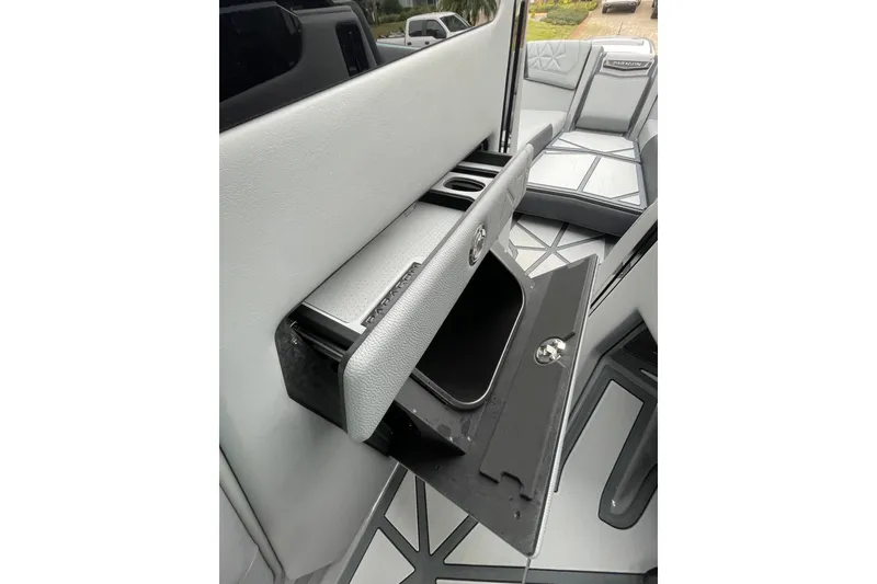 Slide: The Image of 2025 Nautique Super Air Nautique G23 Paragon interior storage compartment detail. - 30