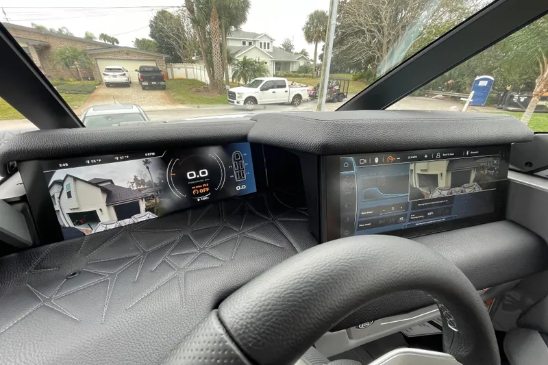 Slide: The Image of 2025 Nautique Super Air Nautique G23 Paragon dashboard with advanced digital displays. - 34