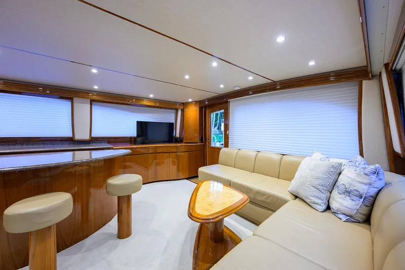 Slide: The Image of Luxurious interior of 2015 Viking 62 Convertible yacht with plush seating and elegant decor. - 10