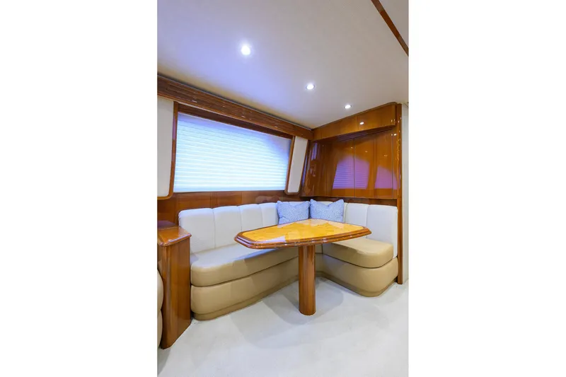 Slide: The Image of Luxurious interior of 2015 Viking 62 Convertible yacht with modern wood finishes and seating. - 14