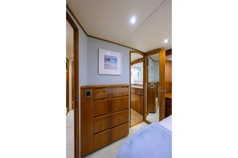 Slide: The Image of Luxurious bedroom interior of 2015 Viking 62 Convertible yacht with wood finishes and modern amenities. - 42