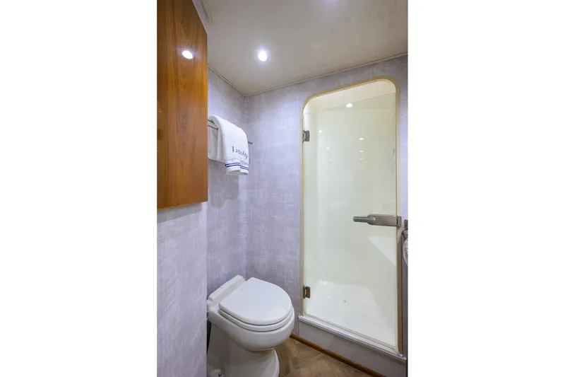Slide: The Image of Luxurious bathroom in 2015 Viking 62 Convertible yacht with shower and elegant fixtures. - 46