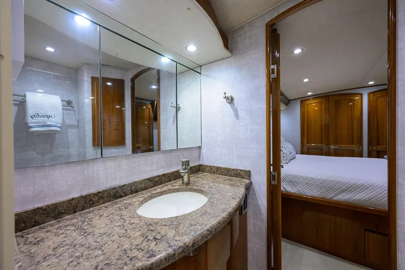 Slide: The Image of Luxurious bathroom in 2015 Viking 62 Convertible yacht with modern fixtures and elegant design. - 47