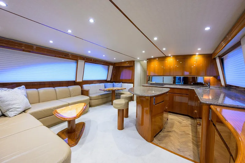 Slide: The Image of 2015 Viking 62 Convertible yacht cruising on open ocean waters. - 5