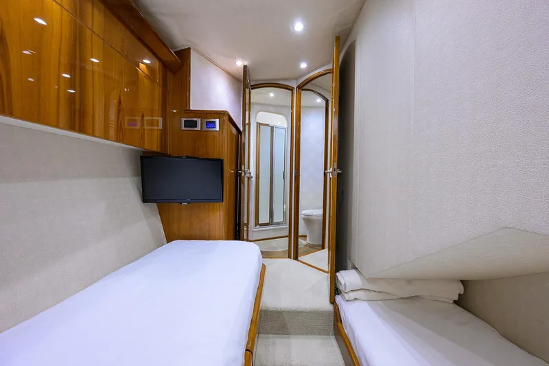 Slide: The Image of Luxurious cabin interior of 2015 Viking 62 Convertible yacht with wooden furnishings. - 51