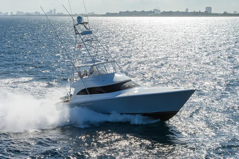 Slide: The Image of Engine room of 2015 Viking 62 Convertible yacht, showcasing complex machinery and components. - 56