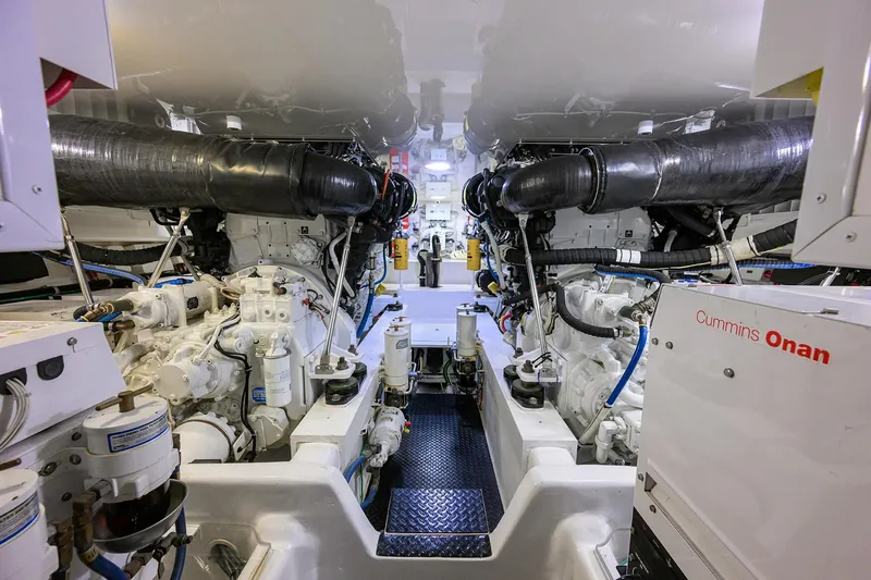 Slide: The Image of Engine room of 2015 Viking 62 Convertible yacht, showcasing machinery and equipment. - 58