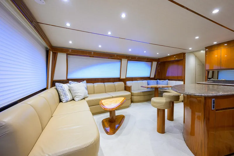 Slide: The Image of 2015 Viking 62 Convertible yacht cruising on open ocean waters. - 6