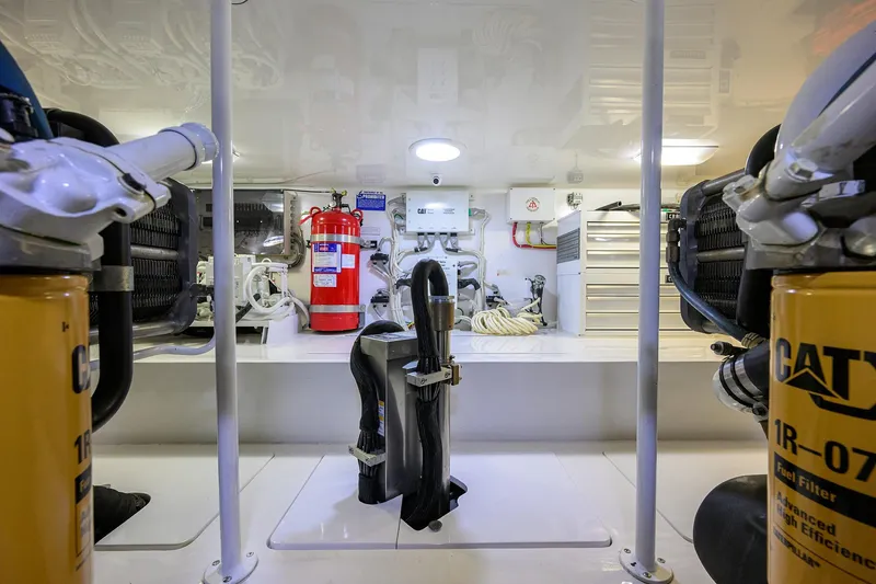 Slide: The Image of Engine room of 2015 Viking 62 Convertible yacht, featuring CAT marine power systems. - 63