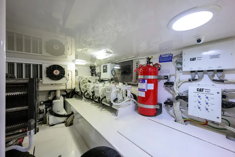 Slide: The Image of Engine room of 2015 Viking 62 Convertible yacht, featuring CAT marine engines. - 65