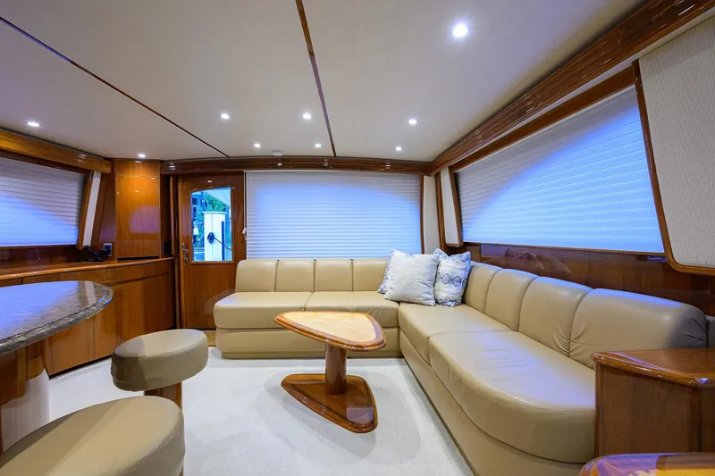 Slide: The Image of 2015 Viking 62 Convertible yacht cruising on open ocean waters. - 7