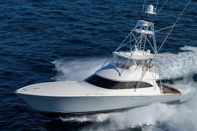 Slide: The Image of 2015 Viking 62 Convertible yacht cruising on open ocean waters. - 74