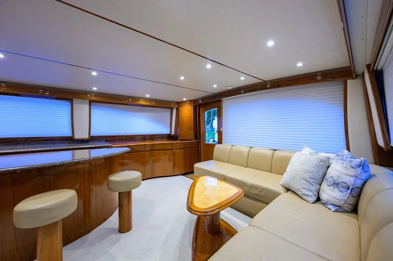 Slide: The Image of Luxurious interior of 2015 Viking 62 Convertible yacht with elegant wood finishes and plush seating. - 8