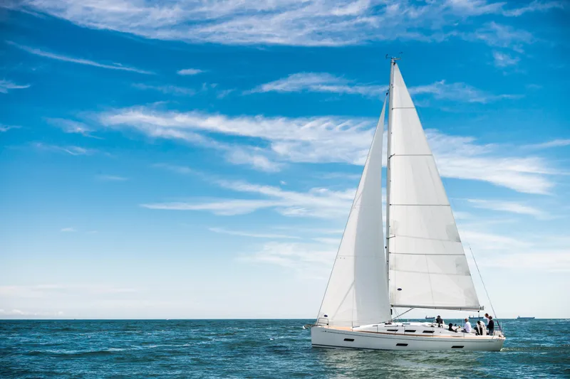 Slide: The Image of Italia Yachts 9.98 sailing on open sea under clear blue sky, 2026 model. - 11