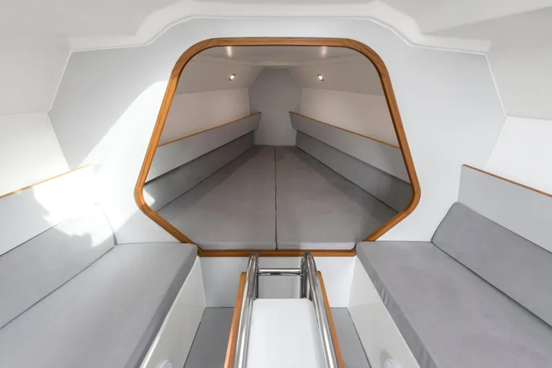 Slide: The Image of Interior of 2026 Italia Yachts 9.98, featuring sleek, modern design with gray seating. - 18