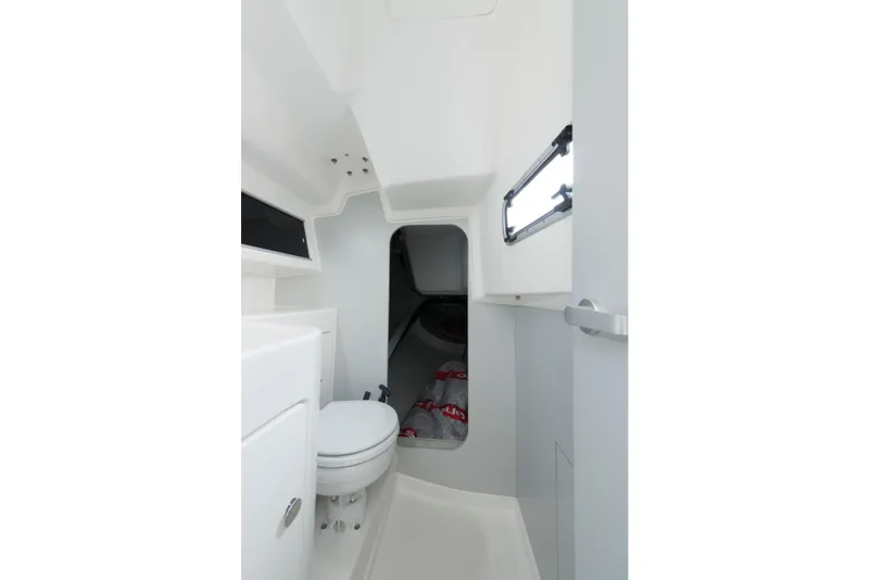 Slide: The Image of Interior of 2026 Italia Yachts 9.98, featuring compact bathroom with modern fixtures. - 24