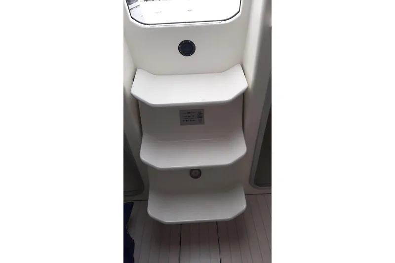 Slide: The Image of Italia Yachts 9.98 (2026) interior steps, white design, modern yacht features. - 26